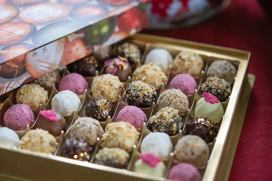 Assorted gourmet chocolate truffles in a get well gift basket for delivery