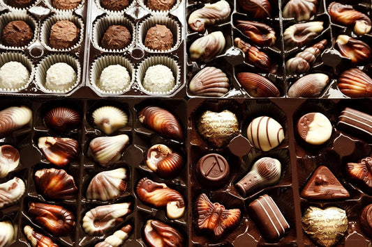 Assortment of gourmet cookies, brownies, and treats arranged in an elegant corporate gift basket