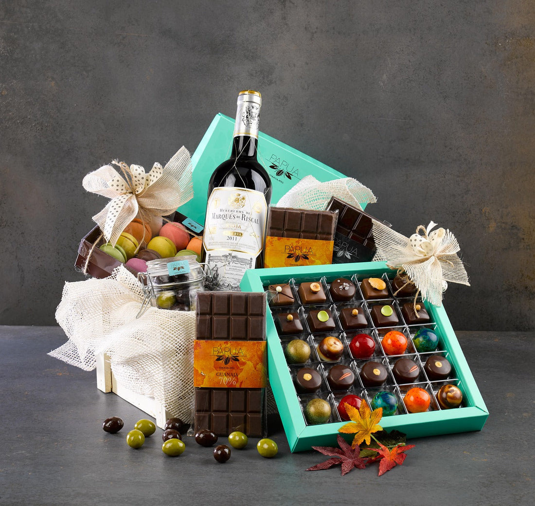 Best gourmet gift baskets with wine, chocolates and sweets arranged in a gift box