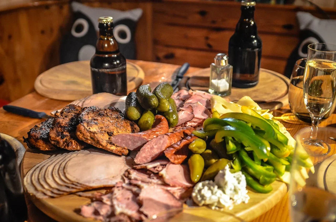 Gourmet charcuterie board with cured meats, cheese, and wine - gift basket ideas for men