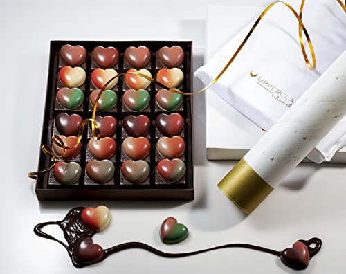 Box of heart-shaped chocolates with a white box labeled 'Lover Rocks' on a light background.